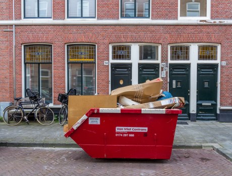 East London residential area with waste collection truck