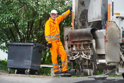 Staff performing garden clearance services